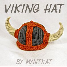 a knitted viking hat with horns on the front and side, in orange and gray