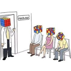 three people are sitting in chairs with cubes on their heads and one man is standing