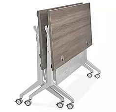 an office desk with wheels and a large screen on the back side, in grey oak