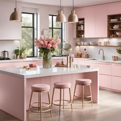 a kitchen with pink cabinets and stools next to a counter top that has flowers on it