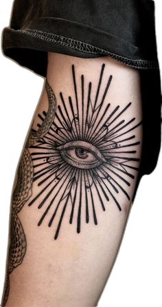 an all seeing eye tattoo on the leg