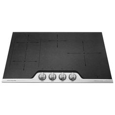 a black stove top with four burners on it