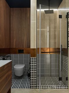 a bathroom with a shower, toilet and sink in it's center area is shown