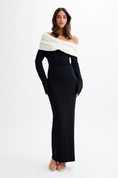 Classic. The YOKO Contrast Knit Maxi Dress is a stunning blend of style and sophistication. Featuring an off-shoulder neckline and a foldover ruched front, this dress elegantly accentuates your silhouette while adding a touch of texture and visual interest. The maxi length creates a graceful and elongated look, making it perfect for both formal events and chic casual outings. This dress is designed to make a statement with its contrast knit and timeless appeal. Black And White Off Shoulder Dress, Guest Dress Winter Wedding, Off Shoulder Winter Dress, Wedding Guest Black Dress Outfit, Black Tie Dresses For Women, Black And White Dress Outfit Formal, Formal Dresses For Plus Size Women, Winter Black Tie Wedding Guest Dress, Apple Body Shape Dresses