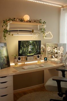 a desk with a computer on top of it in front of a window and some plants