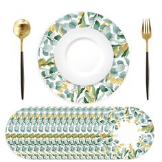 a table setting with plates, silverware and placemats in various designs on them