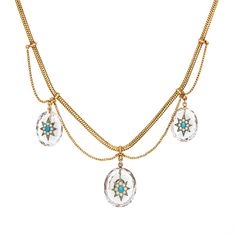 Finely detailed antique Victorian rock crystal necklace (circa 1870s), crafted in 14 karat yellow gold.  Faceted rock crystal drops measure 23mm x 18mm (2) and 26mm x 21mm (1). Small turquoise cabochons measure from 1mm to 4mm. Seed pearls measure 1.5mm each. The stones are in-tact and in good condition. The rock crystal is in good condition and free of cracks or chips.   The bold and beautifully detailed necklace highlights three rock crystal drops that drape from a fine link snake chain. Star set with pearl and turquoise cabochons the rock crystal lights up and shimmers with your every movement. A truly magical necklace that comes with the original burgundy velvet fitted case from the British firm Howell, James & Co. The historic jewelry firm operated in London from 1819 to 1911, known f Rock Crystal Necklace, Masonic Jewelry, Ancient Egyptian Jewelry, Russian Jewelry, Victorian Pendants, Nouveau Jewelry, Antique Jewelry Necklace, Jewelry Mens, Detailed Necklace