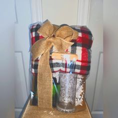 a basket filled with items sitting on top of a wooden table next to a door