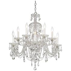 a crystal chandelier with five lights hanging from the bottom and one light on top