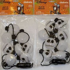 two packages of halloween decorations with jack skellingy faces and headphones on them