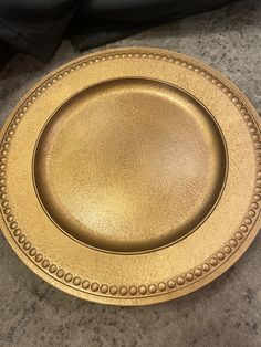 a gold plate sitting on top of a table