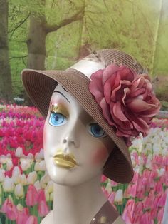 Gorgeous polypropylene hat - these hats are meant for special occasions mostly but it might be suitable for a few casual events as well. Brown hat with 2.75 inch brim with beige satin ribbon - mauve flower and little touches of feathers to add accent. One size fits up to 23.75 inches head circumference. Elegant Brimmed Boater Hat For Country Events, Spring Fedora Sun Hat For Church, Spring Church Hats With Brim, Cream Fedora Sun Hat For Kentucky Derby, Summer Fedora Sun Hat For Church, Top Hat For Kentucky Derby And Country Events, Kentucky Derby Cream Fedora Sun Hat, Beige Mini Bucket Hats For Spring, Short Brim Top Hat For Kentucky Derby