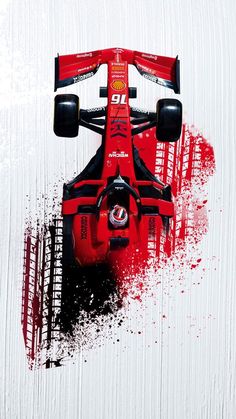 a red race car is flying through the air with paint splatters around it