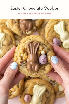 someone is holding up some cookies with bunny ears on them and eggs in the middle