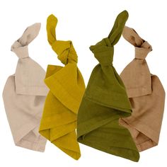 three different colors of scarves are shown in this image, one is green and the other is beige