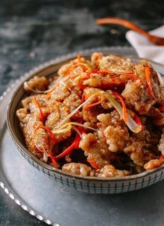 a bowl filled with food sitting on top of a table