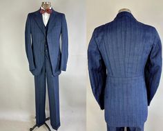 Heads will turn as you stroll down the vanity fair in this amazing 1930's suit!  Made of a deep indigo blue herringbone wool with golden pinstripe trios and standout red and turquoise flecks that give a fantastic pop! The single breasted jacket features a 2 button closure with matching pairs of smaller buttons at the cuffs, wide notch lapels, belted action back with box pleat up the center and knife pleats radiating out to the shoulders, jetted chest pocket, two welted hip pockets, one inner pocket, and butterfly lining. Four-pocket vest with 5 matching buttons is fully lined and backed in rayon with a waist adjuster. The trousers have a button fly, pleated front, a full set of suspender buttons, five welted pockets with fancy curved smile pockets  in the back, and healthy cuffs. By "Inter Vintage Double Breasted Suit With Notch Lapel For Semi-formal, Striped Double-breasted Suit With Double Button Closure, Semi-formal Pinstripe Suit With Double Button Closure, Double-breasted Pinstripe Suit With Double Button Closure, Classic Blue Three-piece Suit With Hidden Button Closure, Pocket Vest, Knife Pleats, Knife Pleat, Fitted Suit