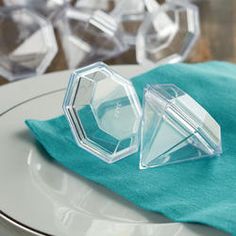 two clear objects sitting on top of a white plate