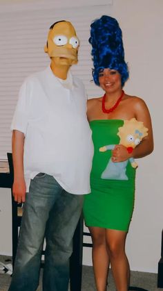 a man and woman dressed up as the simpsons