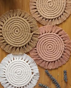 three round woven coasters on a wooden table