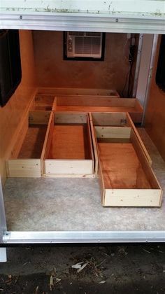 the inside of a truck with drawers in it