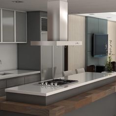 a modern kitchen with stainless steel appliances and counter tops