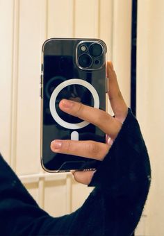 a person holding an iphone in their hand