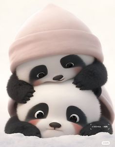 two panda bears are hugging each other in the snow, one is wearing a pink hat