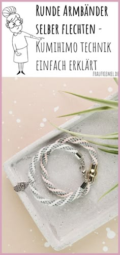 an advertisement for a jewelry store featuring two bracelets on a tray with grass in the background