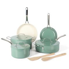 green pots and pans with wooden utensils