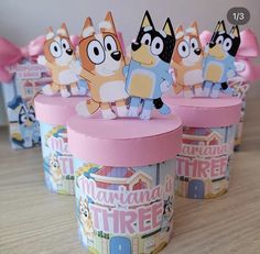 there are many small cups that have animals in them on top of each other,