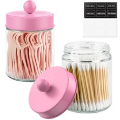 two jars with matches, one pink and the other white