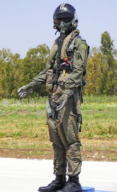 a man in an air force uniform is standing on a skateboard