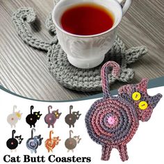 there is a crocheted cup holder with cats on it and a mug in the shape of a cat