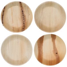 four wooden plates with different designs on them