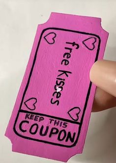 someone is holding up a pink coupon card with hearts on it and the words free hugs keep this coupon