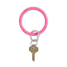 a pink keychain with a metal ring and two keys attached to the end