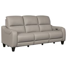 a gray leather couch sitting on top of a white floor