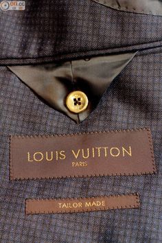 a label on a jacket that says louis vuitton paris tailor made in france