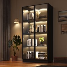 a book shelf with many books on it in a living room next to a potted plant