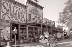 an old black and white photo of a store front