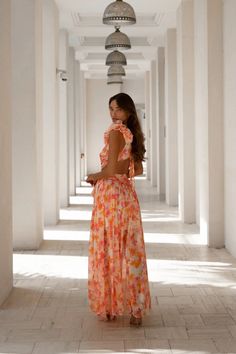 Exude elegance with the Clementine Floral Maxi Dress. Crafted from vibrant floral fabric, this show-stopping maxi cascades in delightful waves of color as bright as fresh-pressed clementines. Feature your figure with a cutout detail, then finish this masterpiece with a delicate lace-up detail along the back. A stunning best-seller in a bold new colour palette, this dress is sure to turn heads. • Zip at the back • Lined • Ties up at the back (tie may come attached or lose in the bag) • Maxi Dress Spanish Wedding Guest, Colourful Dress, Maxi Outfits, Boho Chic Outfits, Dress 16