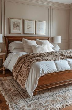 a large bed sitting in a bedroom on top of a wooden floor next to a window