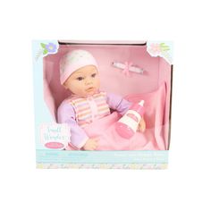 a baby doll in a pink box with accessories