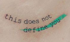 a tattoo saying, this does not define you