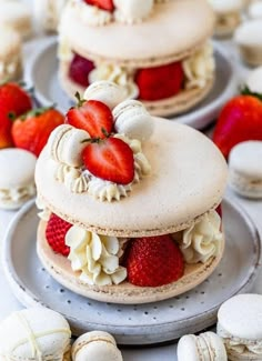 there are three cakes with strawberries on top