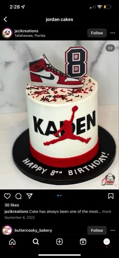 a cake with the number 8 on it is decorated in red and white icing