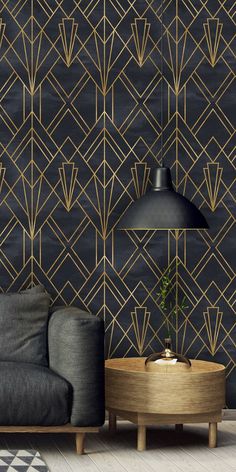 a modern living room with black and gold wallpaper, a grey couch and a wooden coffee table