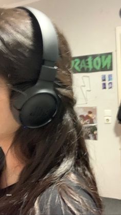 a woman with headphones on her ears