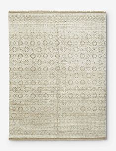 a beige rug with an intricate design on it